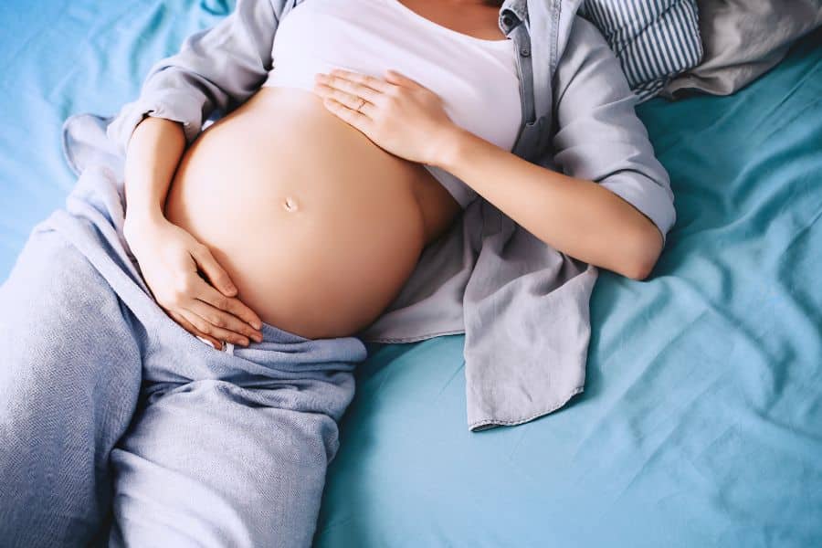 Haptonomy - Pregnant Woman Relaxing Holding her Belly